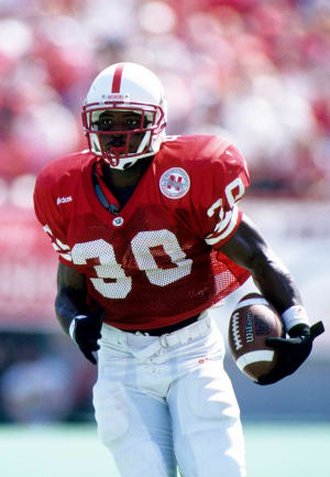 Ahman Green runs with the ball during college football game